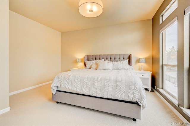 bedroom featuring carpet flooring and multiple windows