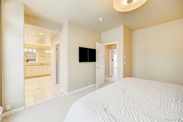 carpeted bedroom with ensuite bath