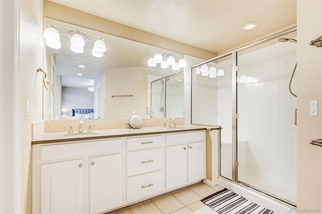 bathroom featuring tile patterned flooring, vanity, and an enclosed shower