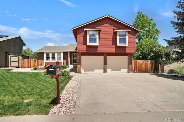 split level home with brick siding, a garage, and driveway