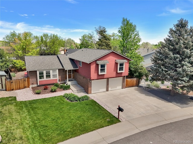 tri-level home with brick siding, concrete driveway, a garage, and roof with shingles