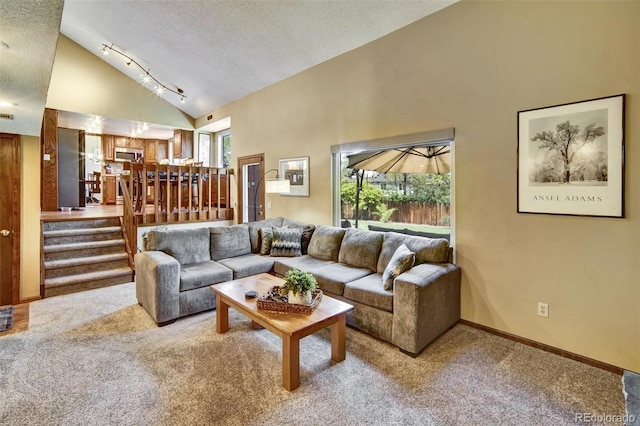 living room featuring carpet, high vaulted ceiling, a textured ceiling, baseboards, and stairway