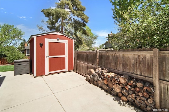 view of shed featuring a fenced backyard