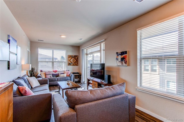 155 S Monaco Street Parkway Unit 311, Denver, CO 80224 - living room with dark wood-type flooring, visible vents, and baseboards