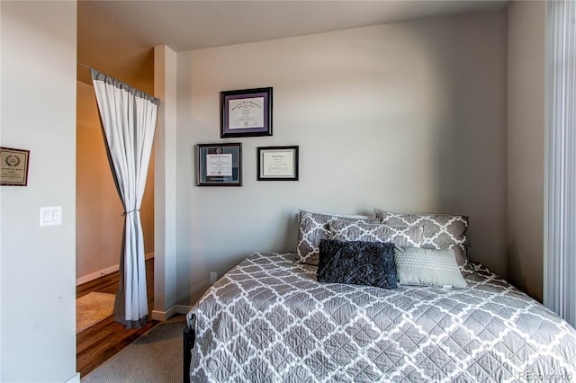 155 S Monaco Street Parkway Unit 311, Denver, CO 80224 - bedroom with baseboards and wood finished floors