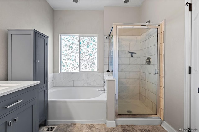 5611 S Sicily Cir, Aurora, CO 80015 - bathroom featuring vanity, a stall shower, a bath, and visible vents