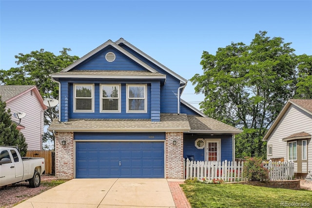 13155 W 63rd Pl, Arvada, CO 80004 - view of front of home with brick siding, driveway, a shingled roof, and a garage
