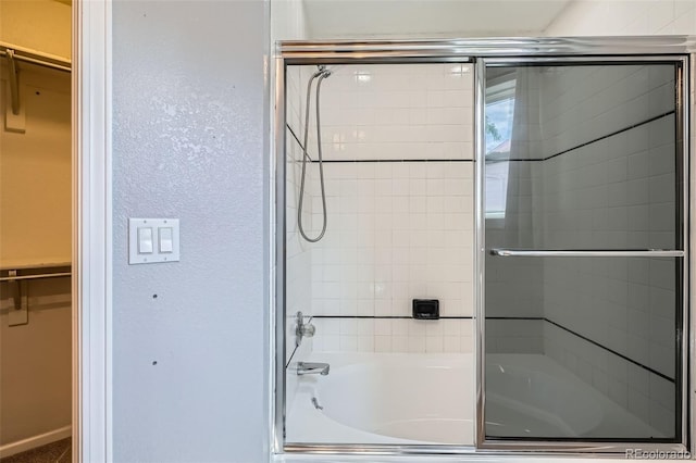 13155 W 63rd Pl, Arvada, CO 80004 - full bath featuring shower / bath combination with glass door and a spacious closet