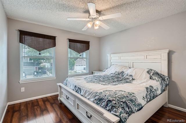13155 W 63rd Pl, Arvada, CO 80004 - bedroom with dark wood-type flooring, a textured ceiling, and ceiling fan