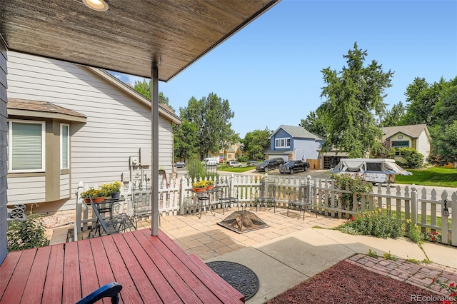 13155 W 63rd Pl, Arvada, CO 80004 - view of patio with an outdoor fire pit and a residential view