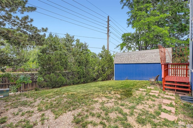 13155 W 63rd Pl, Arvada, CO 80004 - view of yard featuring a deck and an outbuilding