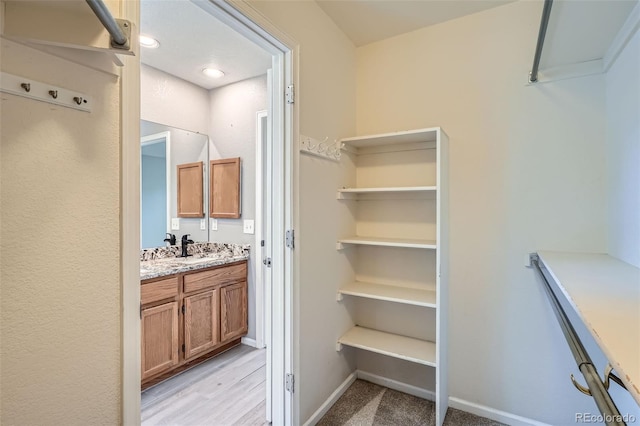 13155 W 63rd Pl, Arvada, CO 80004 - walk in closet featuring a sink