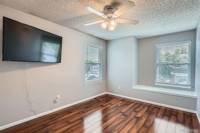 13155 W 63rd Pl, Arvada, CO 80004 - spare room featuring hardwood / wood-style floors, a textured ceiling, and ceiling fan