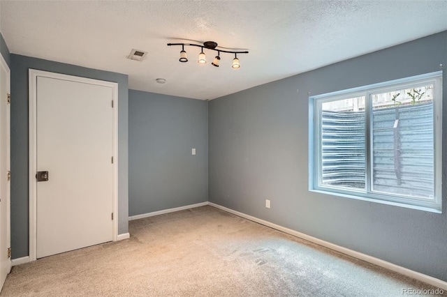 13155 W 63rd Pl, Arvada, CO 80004 - spare room with carpet flooring and a textured ceiling
