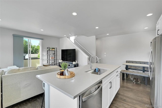 7035 E 38th Ave Unit 4, Denver, CO 80207 - kitchen featuring a sink, stainless steel appliances, open floor plan, white cabinets, and dark wood-style floors