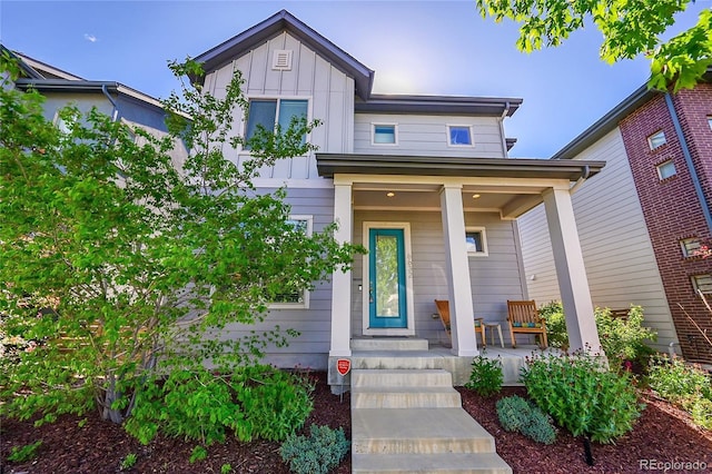 6632 Osage St, Denver, CO 80221 - view of front facade with board and batten siding and a porch