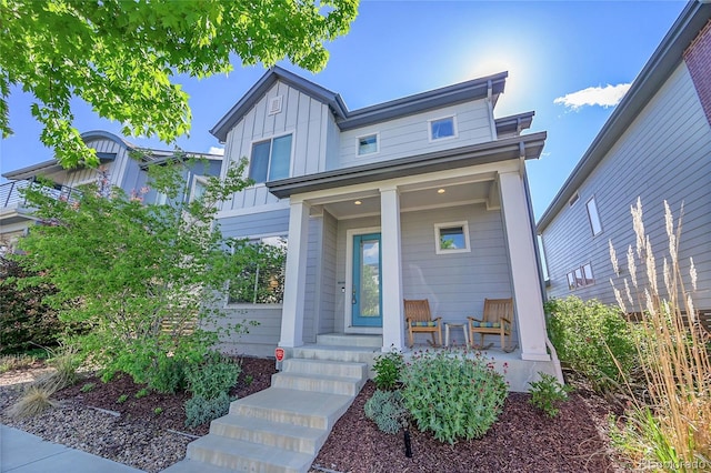 6632 Osage St, Denver, CO 80221 - view of front of house featuring covered porch and board and batten siding