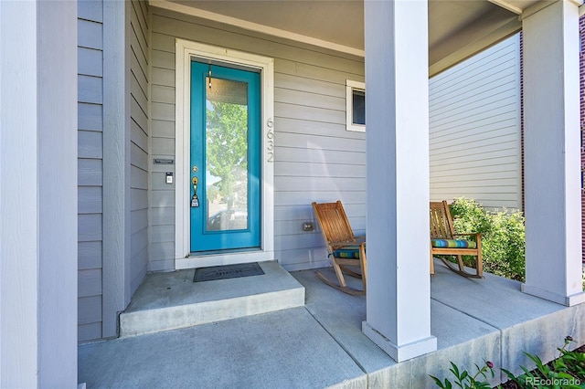 6632 Osage St, Denver, CO 80221 - doorway to property featuring covered porch