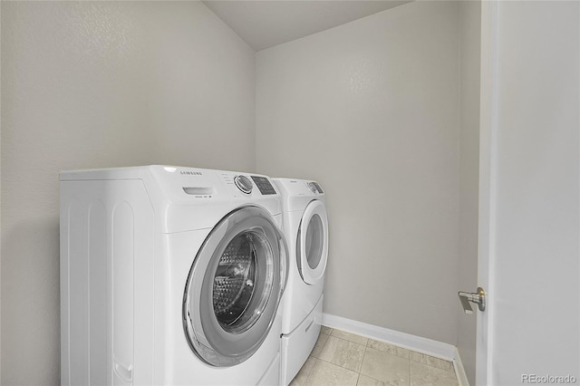 6632 Osage St, Denver, CO 80221 - laundry area featuring separate washer and dryer, baseboards, and light tile patterned floors