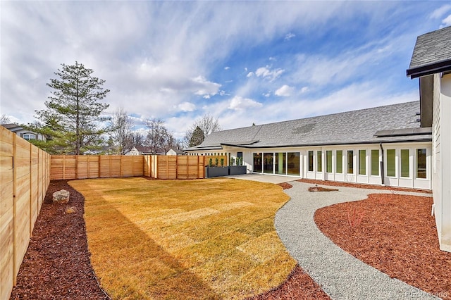 view of yard featuring a patio and a fenced backyard