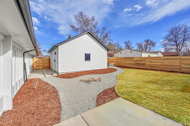 view of yard with a patio and a fenced backyard