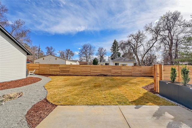 view of yard with a fenced backyard