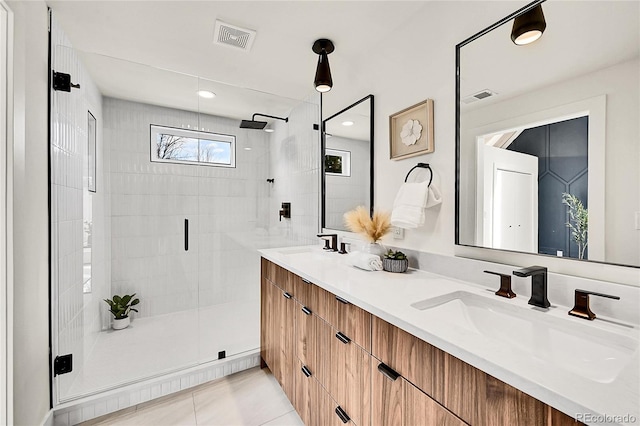 full bath with a stall shower, visible vents, and a sink