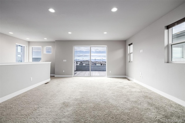6018 Beeler Ct, Denver, CO 80238 - unfurnished room with light carpet, recessed lighting, baseboards, and plenty of natural light