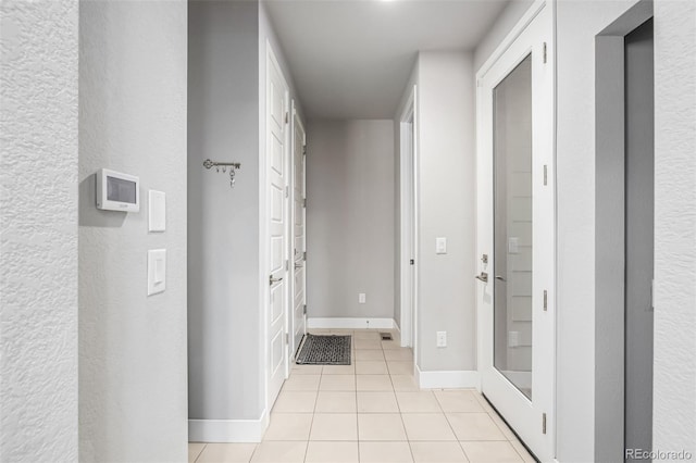 6018 Beeler Ct, Denver, CO 80238 - corridor featuring light tile patterned floors and baseboards
