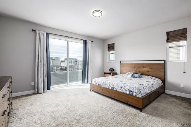 6018 Beeler Ct, Denver, CO 80238 - carpeted bedroom featuring access to outside and baseboards