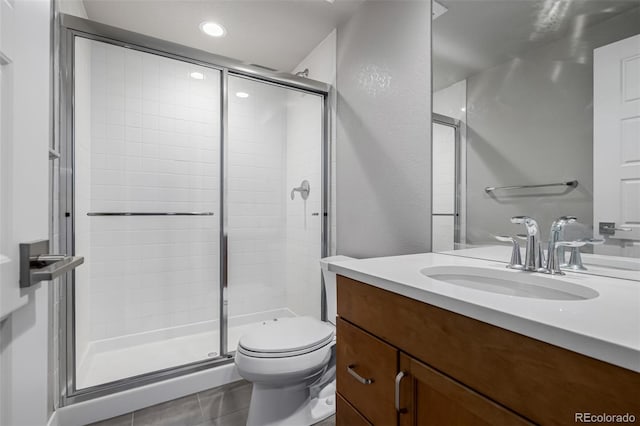 6018 Beeler Ct, Denver, CO 80238 - full bathroom with a stall shower, toilet, tile patterned floors, vanity, and recessed lighting