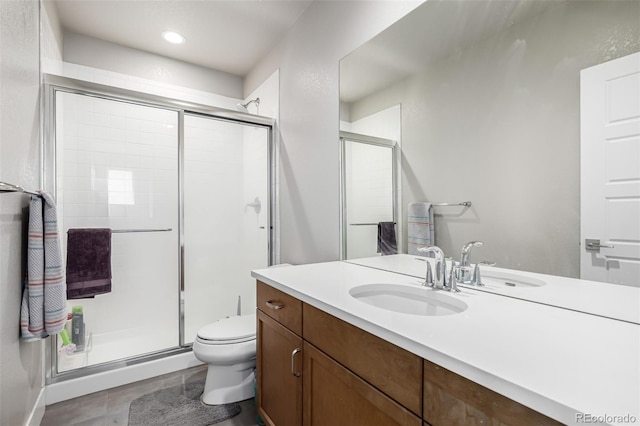 6018 Beeler Ct, Denver, CO 80238 - full bathroom with a stall shower, toilet, vanity, recessed lighting, and tile patterned flooring