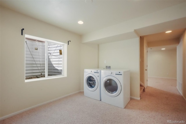 laundry area with laundry area, baseboards, washing machine and clothes dryer, carpet flooring, and recessed lighting