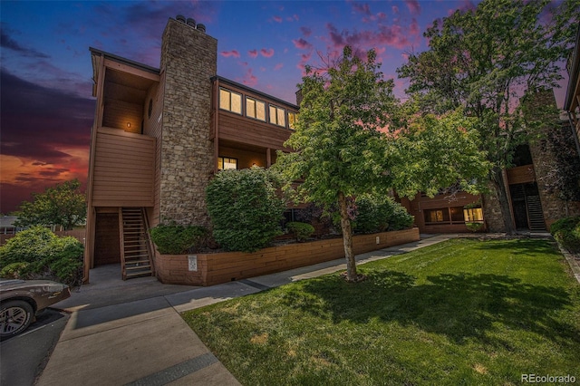 4681 S Decatur St Unit 327, Englewood, CO 80110 - view of front of property with stairs, a lawn, and a chimney