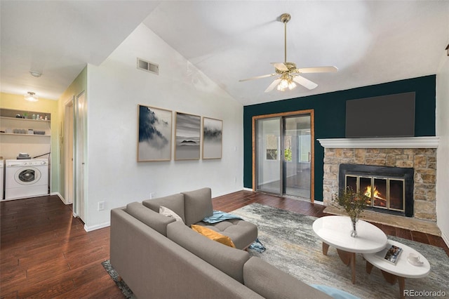 4681 S Decatur St Unit 327, Englewood, CO 80110 - living room with separate washer and dryer, wood finished floors, vaulted ceiling, ceiling fan, and a fireplace