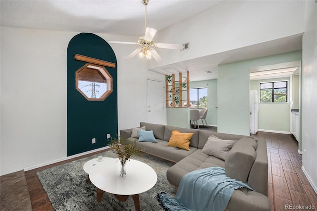 4681 S Decatur St Unit 327, Englewood, CO 80110 - living area with wood finished floors, healthy amount of natural light, baseboards, and ceiling fan