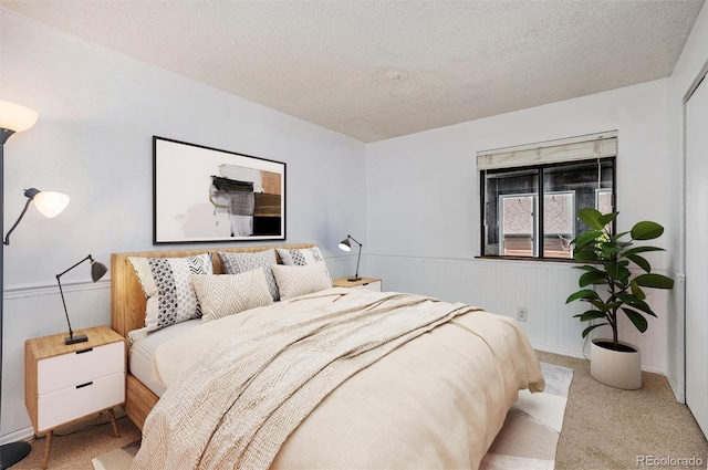 4681 S Decatur St Unit 327, Englewood, CO 80110 - bedroom with carpet flooring and a textured ceiling