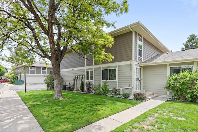 1250 S Monaco Pkwy Unit 50, Denver, CO 80224 - view of front of house featuring a front lawn