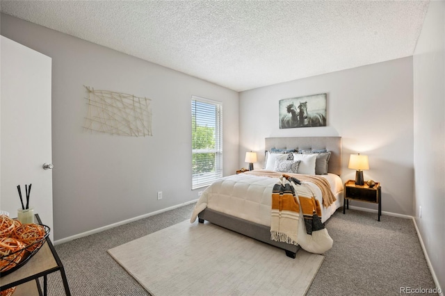 1250 S Monaco Pkwy Unit 50, Denver, CO 80224 - bedroom featuring carpet and a textured ceiling