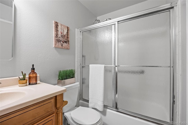 1250 S Monaco Pkwy Unit 50, Denver, CO 80224 - bathroom with vanity and bath / shower combo with glass door