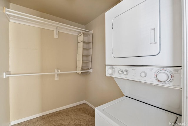 1195 S Oneida St Unit E, Denver, CO 80224 - washroom with stacked washer / drying machine and carpet flooring