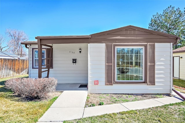 view of front of house with fence