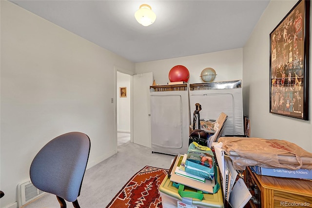 laundry room featuring visible vents, baseboards, light colored carpet, and washer and clothes dryer