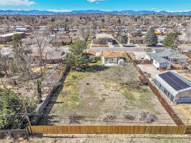 aerial view featuring a mountain view and a residential view