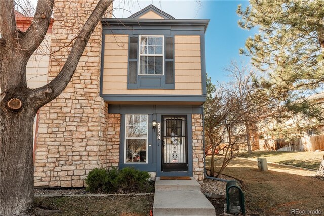 view of front of home featuring stone siding