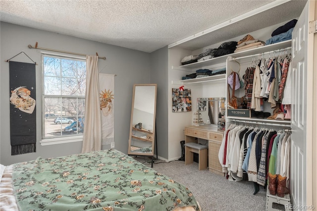 carpeted bedroom featuring a closet and a textured ceiling