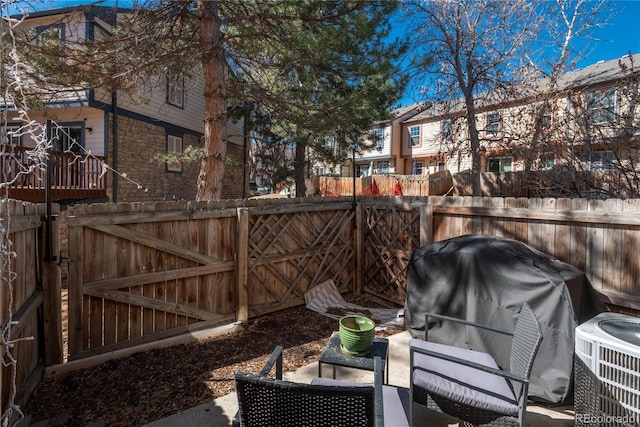 view of patio / terrace featuring cooling unit, fence, and grilling area