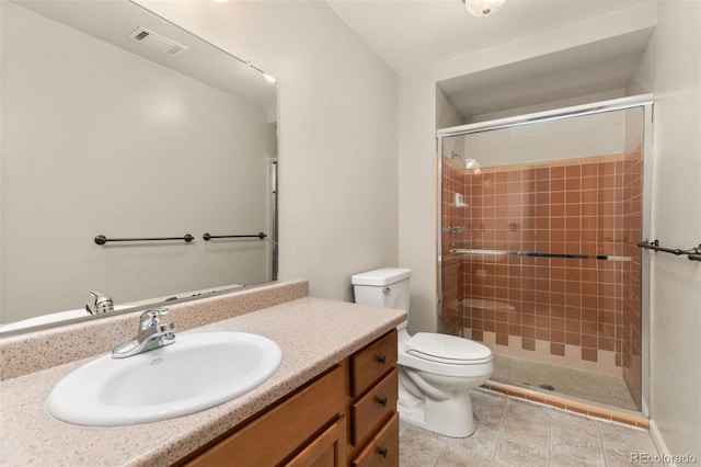 bathroom featuring toilet, an enclosed shower, and vanity