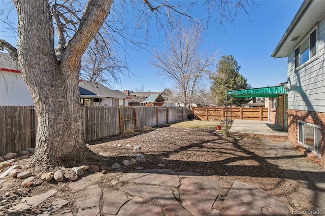 view of yard with a patio area and a fenced backyard