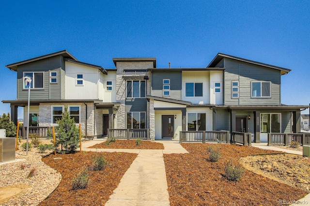14578 W 90th Ln Unit B, Arvada, CO 80005 - view of front of home with stone siding and covered porch